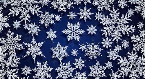 Intricate white ice crystal snowflakes scattered across a dark blue winter holiday background