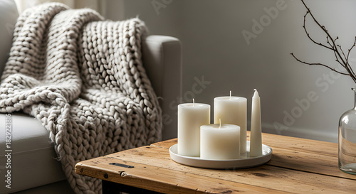 Cozy Ambiance Candles on Wooden Table with Knitted Blanket