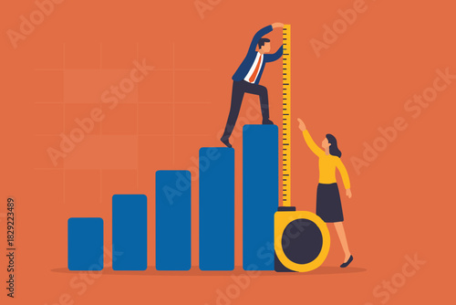 Business benchmark measurement, KPI, key performance indicator to evaluate success, improvement or business growth concept, businessman and woman help using measuring tape to measure bar graph.
