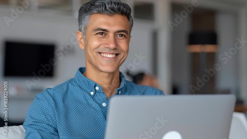 Wallpaper Mural Smiling indian man male adult leader worker modern office workplace desk with laptop computer, confident calm portrait closeup, grey hair professional mood positive energy team collaborate indoor Torontodigital.ca