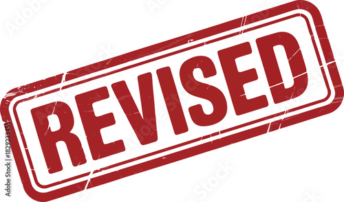 A clear red grunge rubber stamp impression stating REVISED is presented against a crisp white surface