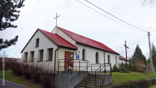 Aerial Zełwagi village Poland old Catholic church slide. Farming fishing town, tourist destination lake district. First building of The Church of Jesus Christ of Latter-day Saints in central Europe.