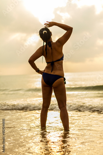 Woman with sunrise and silhouette