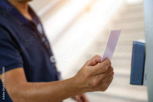 Hand scanning proximity ID card on reader access control system to security door unlock for identity or verification identify for safety detect fingerprint scan or check attendance.