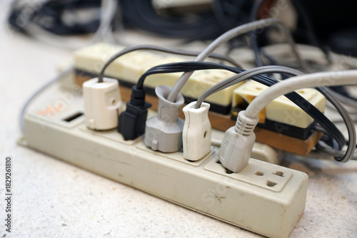 Old electrical extension cords plug is broken case damage and danger or connector voltage power burnt overload