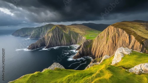 Dramatic coastal scenery with rugged cliffs and a dramatic sky.