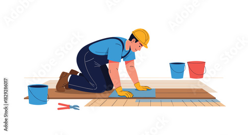 A male construction worker wearing a hard hat, overalls, and gloves is kneeling on the floor, installing a tile or flooring plank.