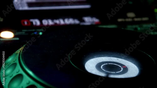 Close up of dj playing party music modern cd player in disco club Nightlife entertainment concept.