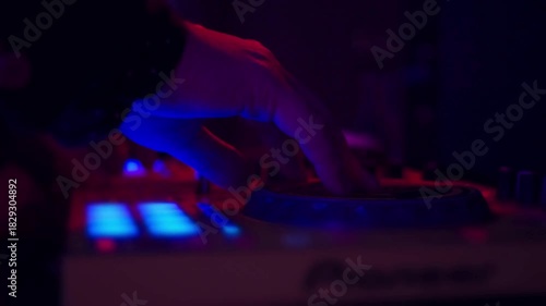 Dj mixer in night club Close-Up of musician Controller Desk in Night Club Disco Party