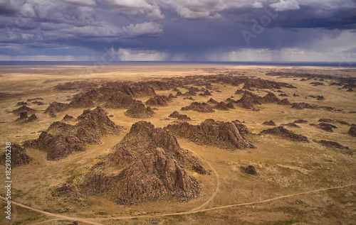 Aerial view of dramatic rock formations in an arid landscape