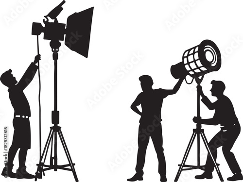 Silhouettes of photographers setting up studio equipment, isolated on