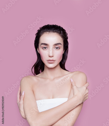 Gorgeous young woman with perfect body shape wearing lingerie underwear top looking fresh happy and healthy posing on pink background