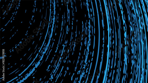Abstract blue light trails on black background.