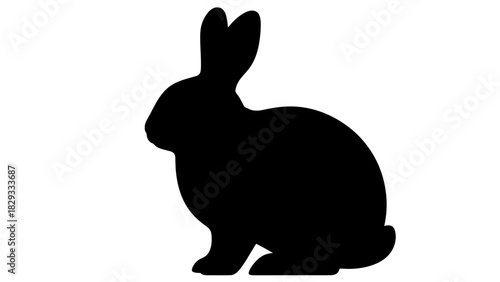 Cute black rabbit sitting peacefully, isolated white background