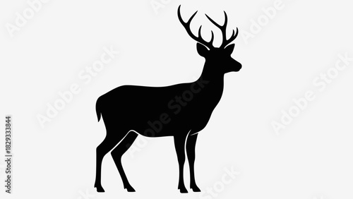 Majestic Deer Buck Silhouette Standing with Large Antlers in Bright Studio Background