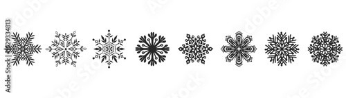 Intricate black snowflake shapes with varying designs are set against a transparent background