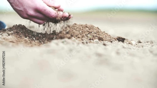 farmer examining earth on his farm. Hand of professional farmer inspecting soil health before planting in farm. hand of person holding abundance soil for agriculture