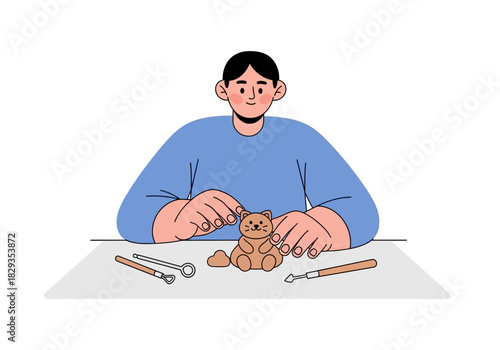 Sculptor creates clay cat with tools perfect for art, creativity, sculpting, crafts, hobbies, ceramic, pottery, and artisan themes.