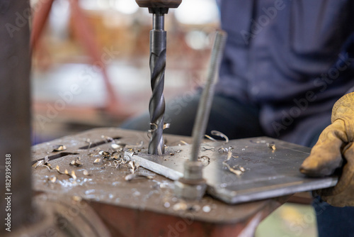 Metal drilling on industrial drill press