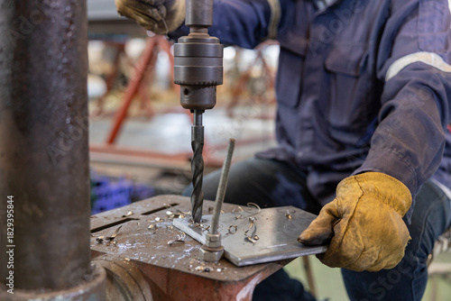 Metal drilling on industrial drill press