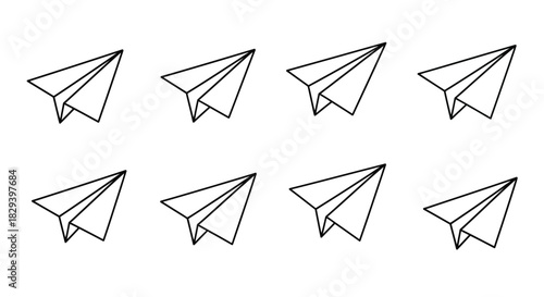 Simple illustration of eight black and white paper airplanes arranged in a grid