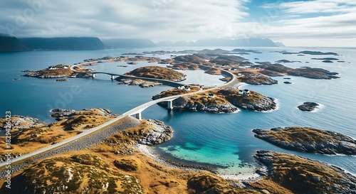 Aerial view of the dramatic atlantic ocean road winding across small, rugged islands under a cloudy sky in norway Background image