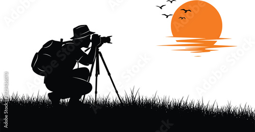 Silhouette of a photographer with a backpack and tripod capturing a vibrant orange sunset over a calm body of water with birds flying