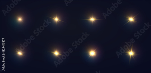 Sparkling golden stars on black background. Various shining sunbeams.