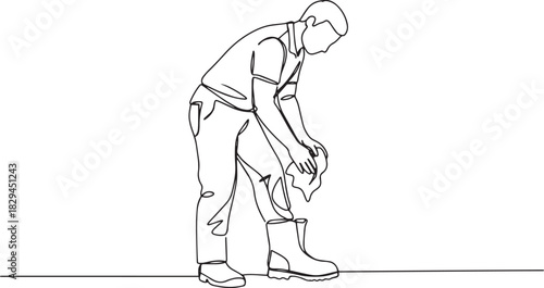 Continuous line drawing of a man cleaning his muddy boot with a