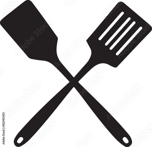 Two crossed kitchen spatulas with long shadows on white background