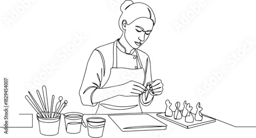 Continuous line drawing showcases a woman sculpting edible figur