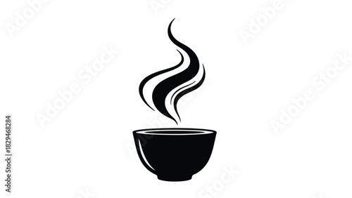 Steaming hot beverage in a dark bowl, creating an aromatic swirl