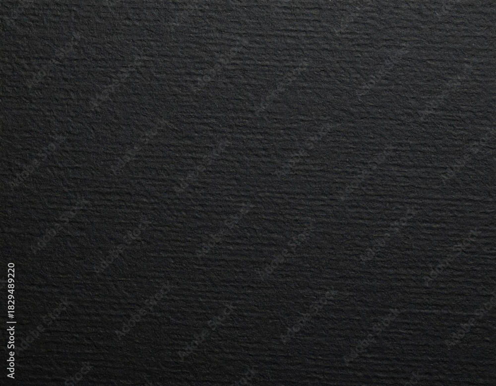 Fototapeta premium Black rough paper texture, close view paper pattern background