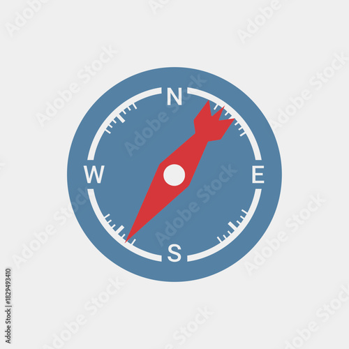 Compass with cardinal directions and a red needle pointing towards north.