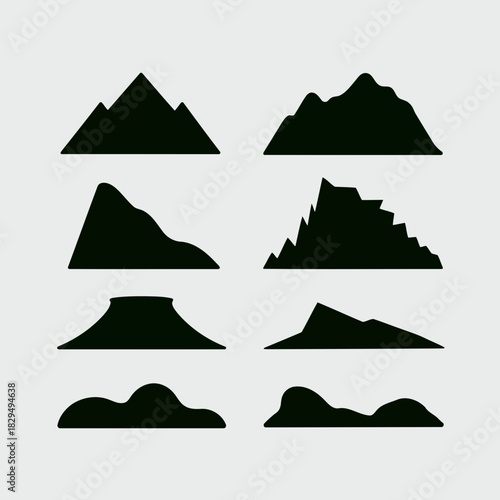Set of nine different mountain silhouettes isolated on