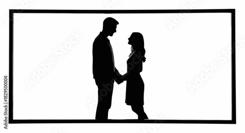 Black silhouette of a romantic couple holding hands together.