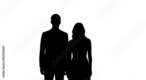 Silhouette of a man and woman standing together, a couple in the shadows.