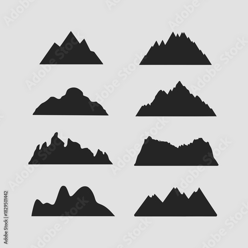 Set of nine different mountain silhouettes isolated on
