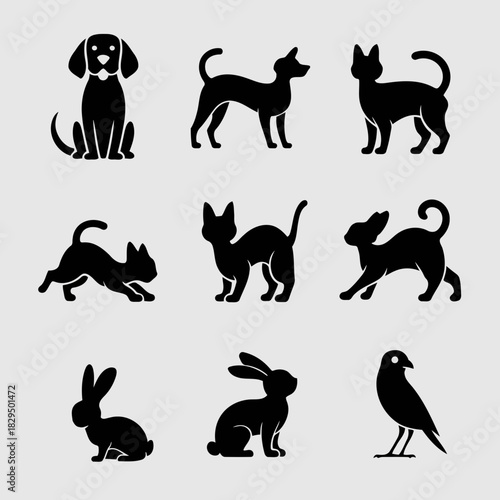 Set of black silhouette icons of various animals including dogs, cats, rabbits, and birds in different poses