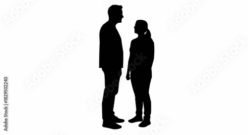 Silhouette of two people standing face to face, contemplating a conversation.
