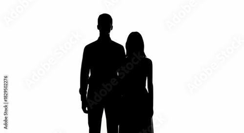 Black silhouette of a man and woman standing together.
