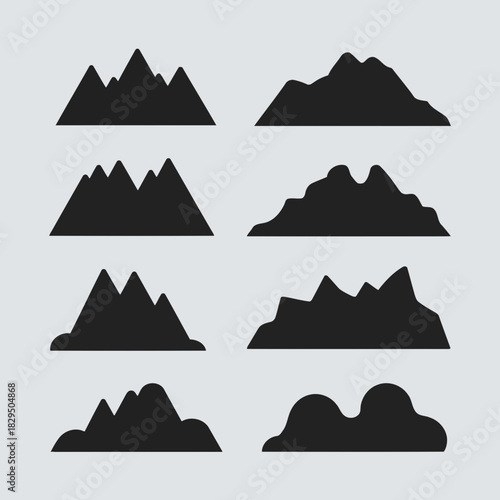 Set of nine different mountain silhouettes in black color isolated on