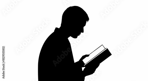 Black silhouette of a young man reading a book intently.