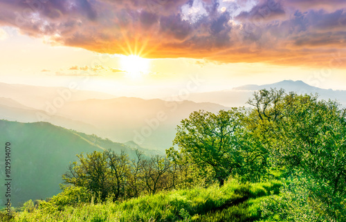 beautiful mountain sunset landcape with great magestic mountains and amazing slopes and canyons with evening clouds. Panorama of vulcano Etna in Sicily, Italy.