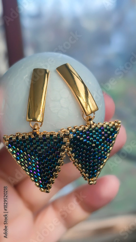 Handcrafted earrings made of beads and glass beads. Silver and gold hardware.