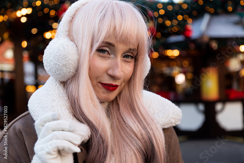 Young girl in headphones at the Christmas market