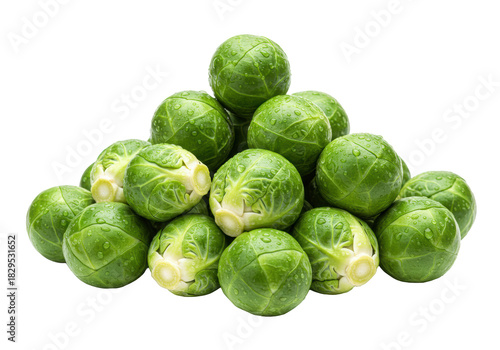 Vibrant emerald green Brussels sprouts with dew drops, artfully piled against a transparent studio background with copy space, soft lighting. Concept of healthy natural produce