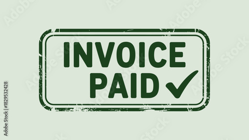 A green rectangular stamp with the words invoice paid and a checkmark on a light green background