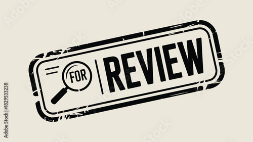 A black rectangular stamp with rounded corners showing the word review and a magnifying glass icon