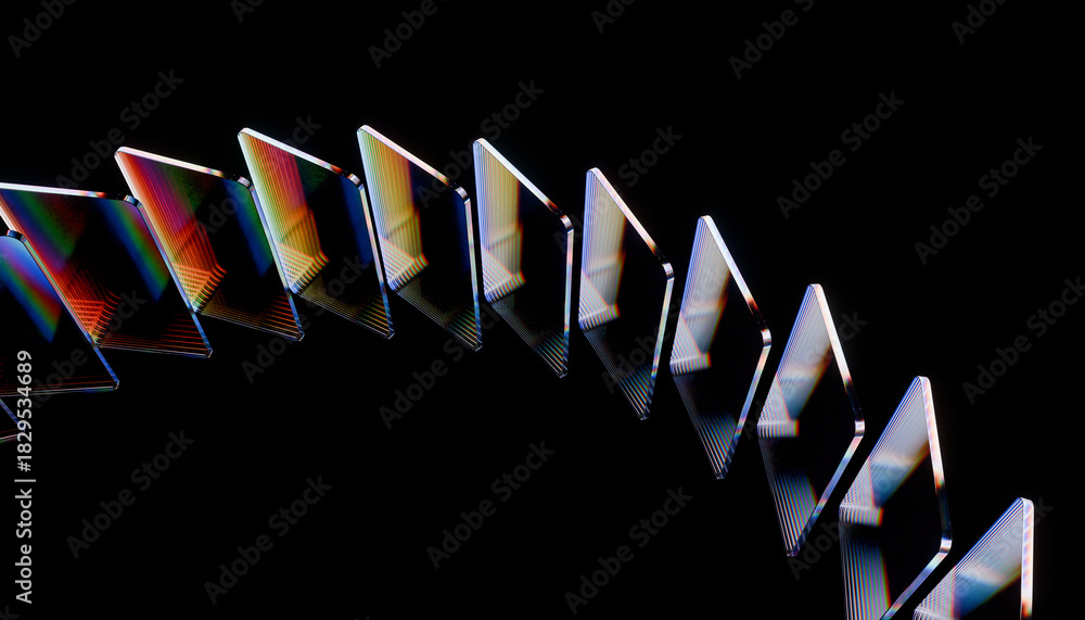 Fototapeta premium Row of colorful, reflective dominoes is arranged in curved line against black background, creating striking visual effect